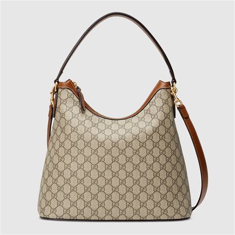 gucci gg borsa tessuto e pelle|Borsa a spalla GG Emblem misura media in tessuto beige e .